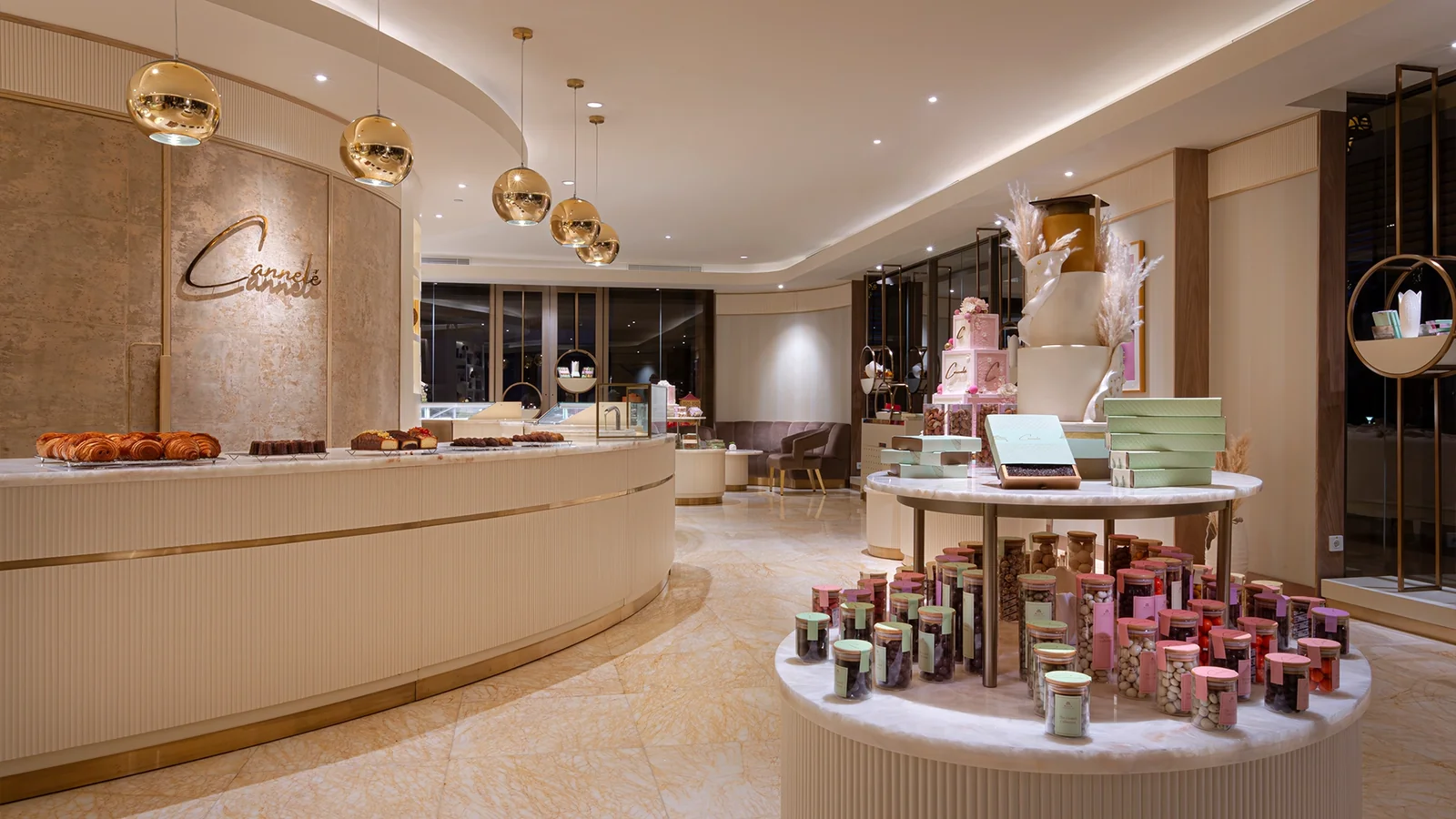 Cream-toned patisserie counter and pastry displays at Canelle in Bali.