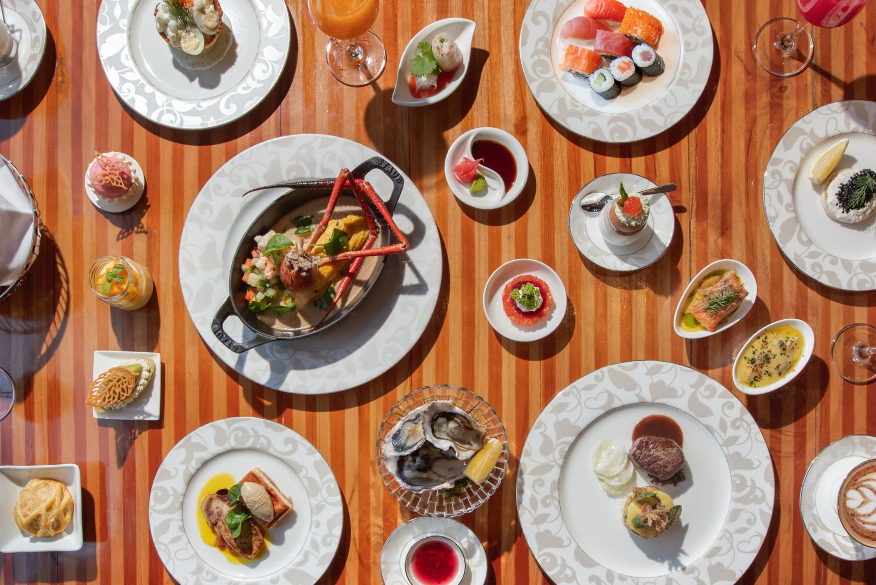 An overhead spread of seafood, sushi and small plates at Boneka.