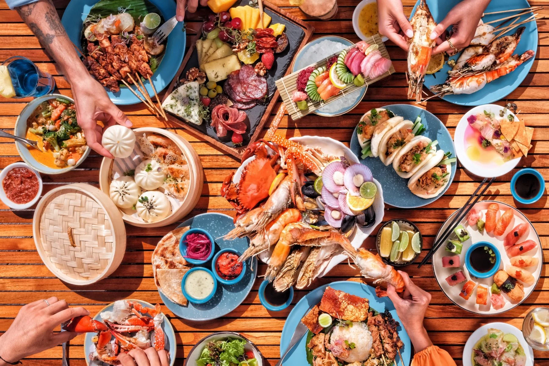 An overhead spread of seafood, sushi and international dishes at W Bali’s Sunday brunch.