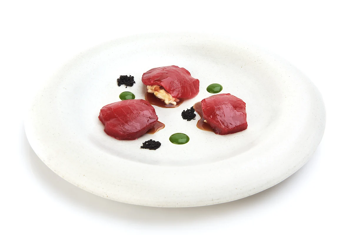 A contemporary Italian dish presented on handmade tableware at MAURI.