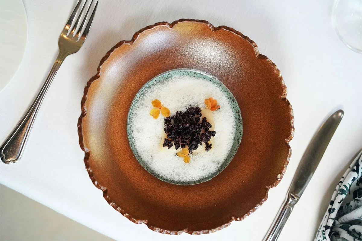 A carefully plated seasonal dish at Mozaic.