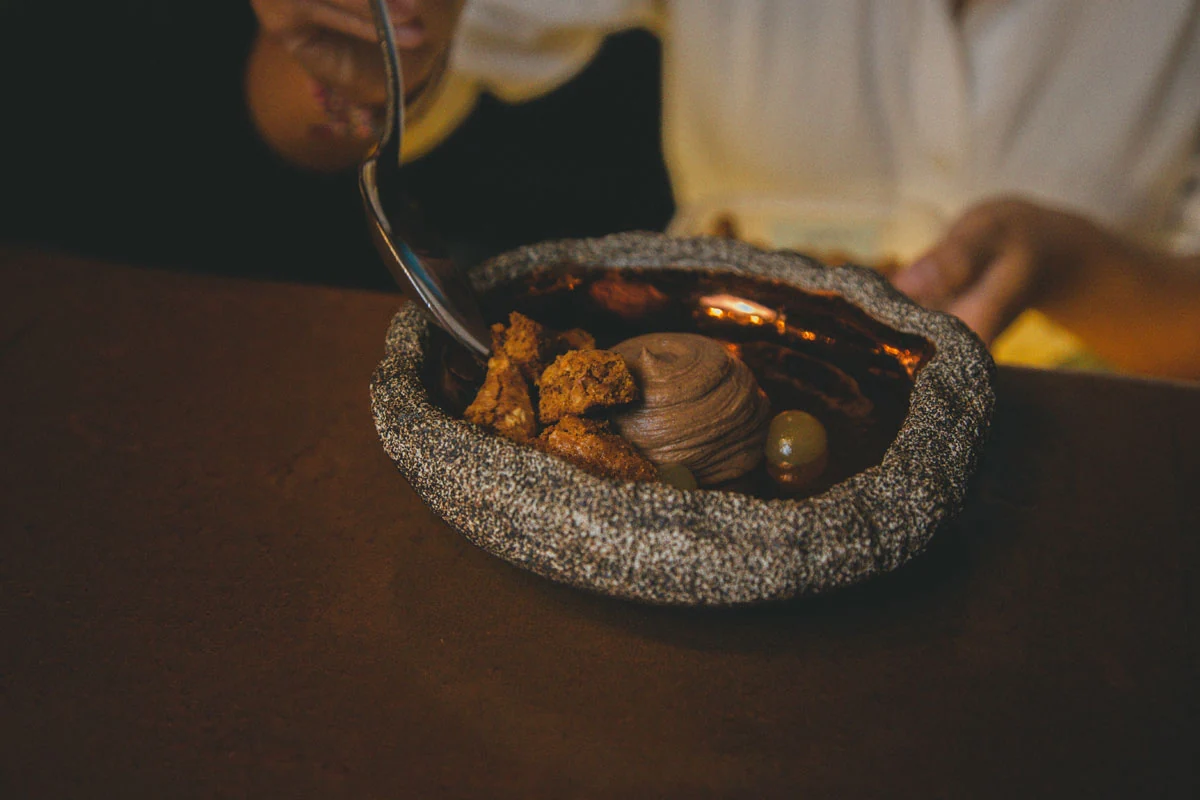 A plated dessert served in a handmade bowl at Room4Dessert.