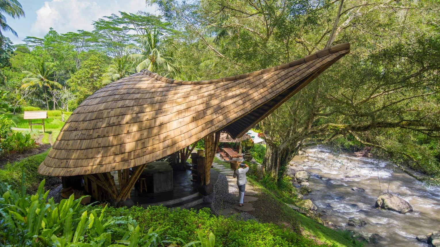 Sokasi’s curved bamboo pavilion beside the Ayung River at Four Seasons Resort Bali at Sayan.