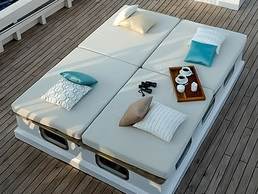 Alexa foredeck daybed with white cushions and turquoise accents