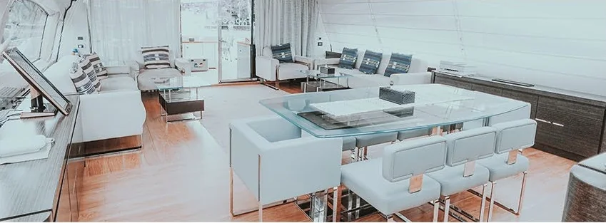 Azimut 103 salon with pale upholstered seating and wide windows