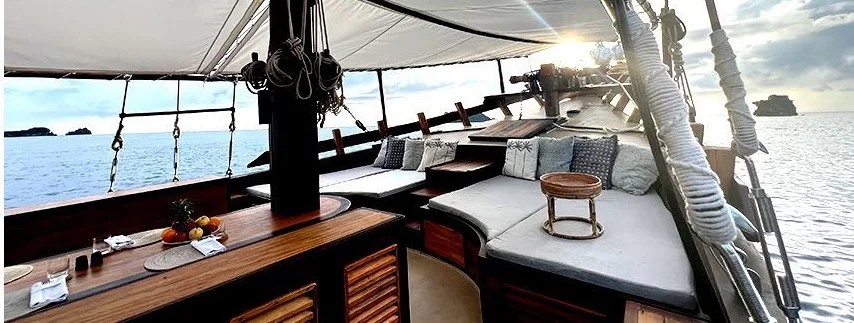 Dewata shaded deck seating beside the water
