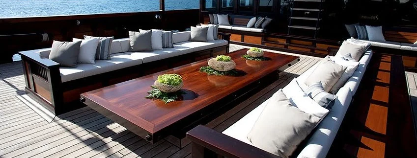 Dunia Baru shaded outdoor lounge with a large wooden table