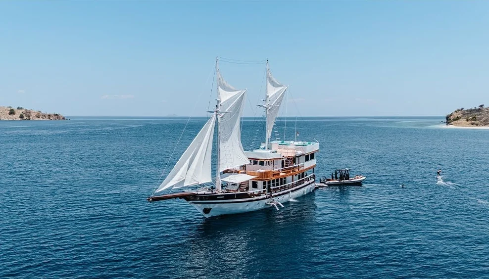 Kayra sailing yacht on blue water beneath a clear sky