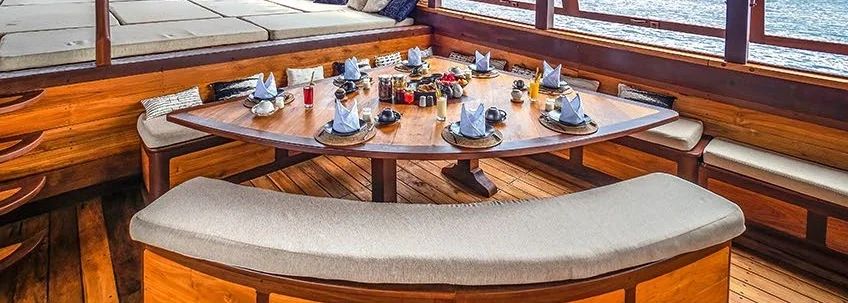Majik dining nook with curved seating and large windows