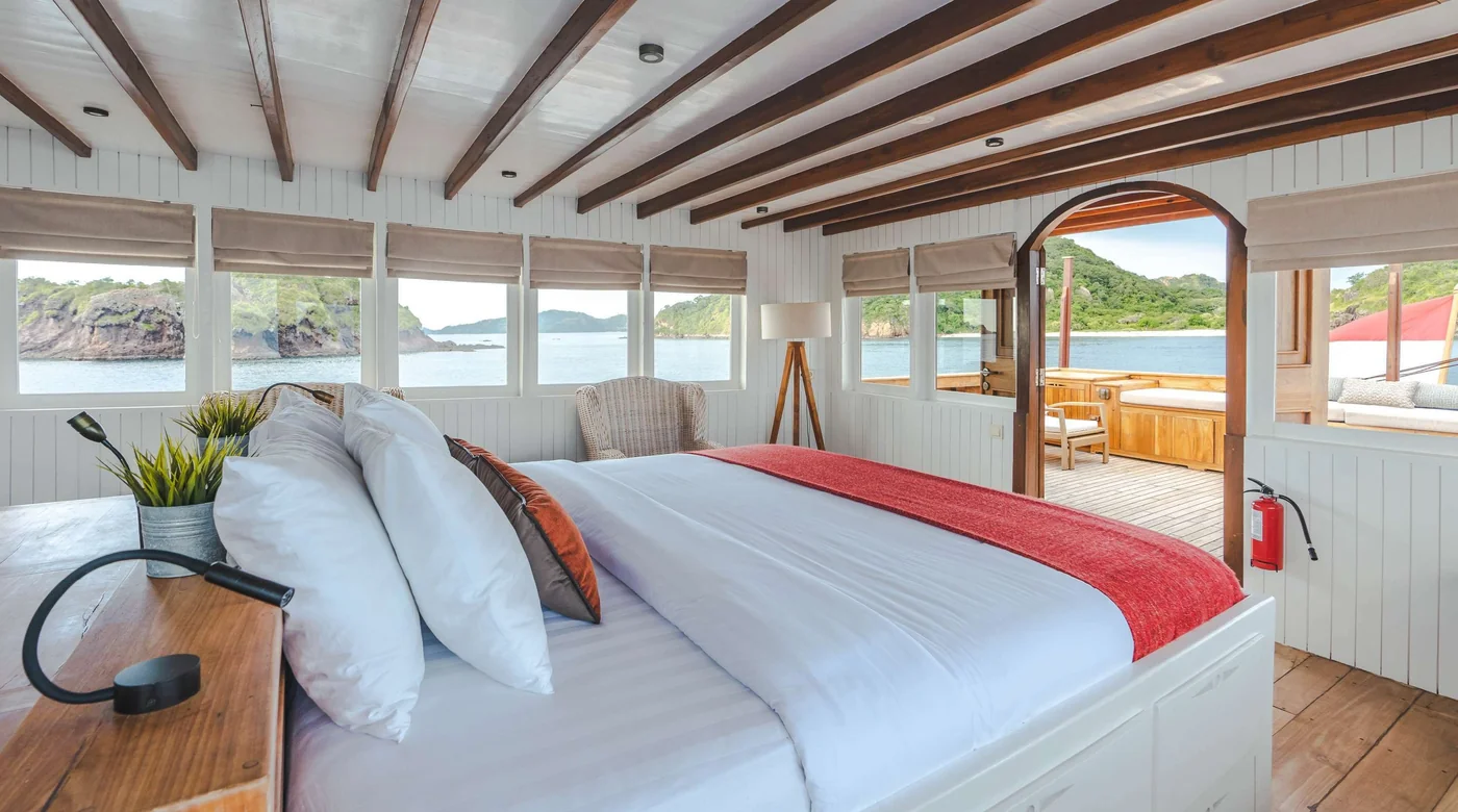 Bright Mischief double cabin with wraparound windows and timber ceiling beams