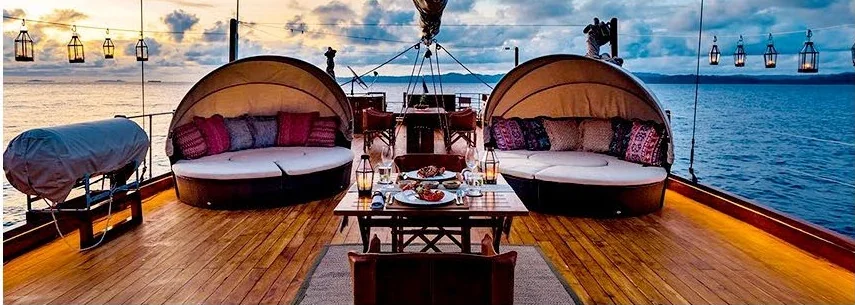 Sequoia deck lounge with rounded daybeds overlooking the sea