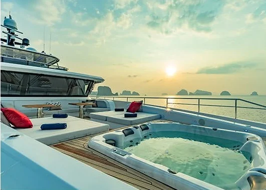 Song of Songs sun deck and hot tub overlooking the sea at sunset