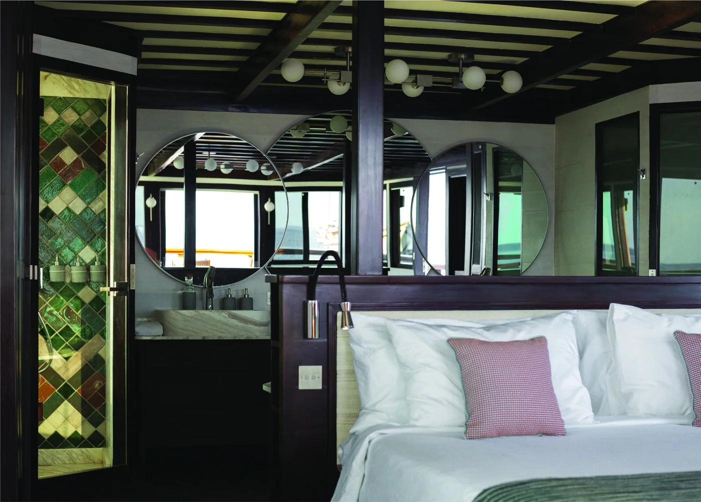 Vela double cabin with green accents and timber ceiling beams