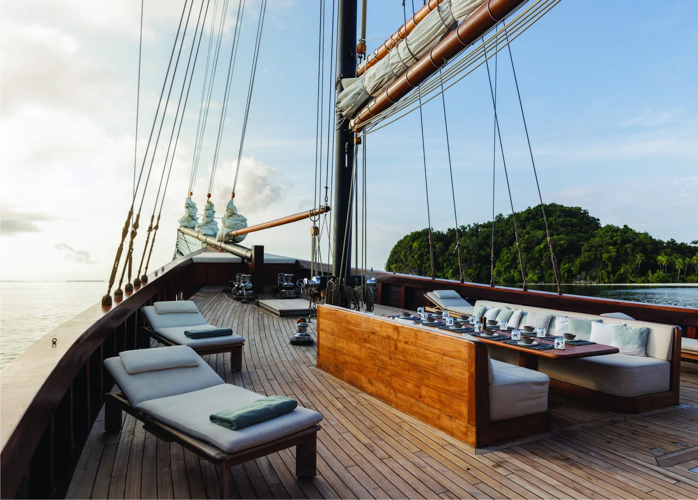 Vela open deck with lounge seating beneath the rigging